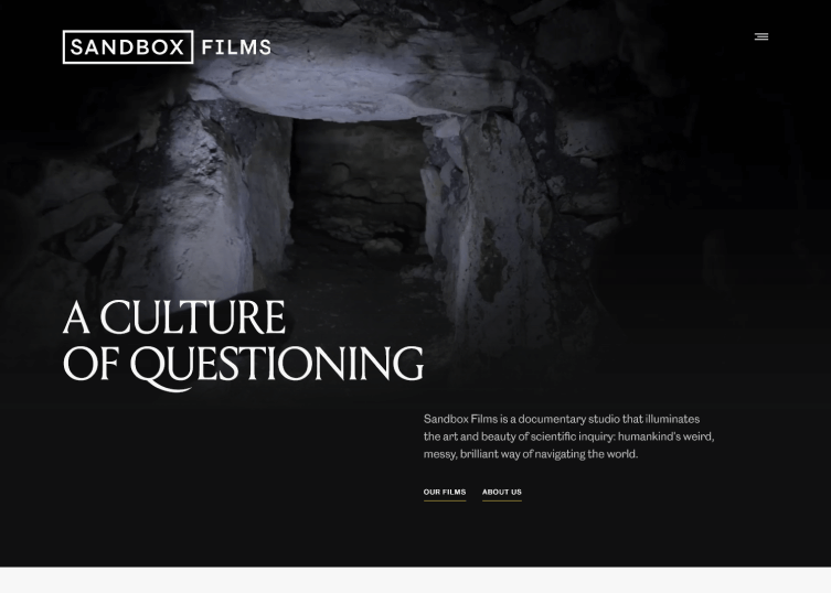 Site of videography company, Sandbox Films, which has a background playing.