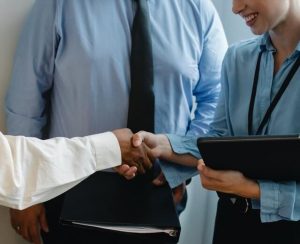Corporate employees handshaking.